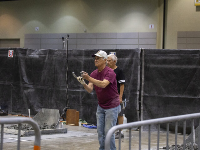 Horseshoe pitcher preparing to throw his horseshoe.