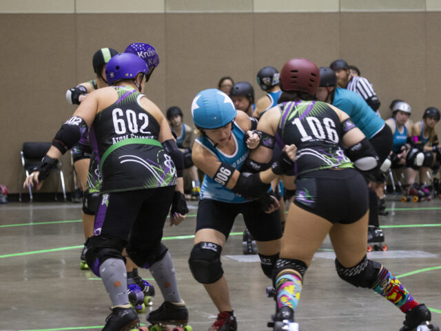Blue roller derby team on the move